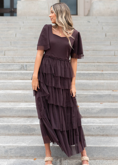 Front view of a plum sweetheart tiered dress with short sleeves