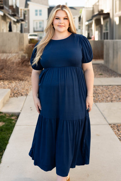 Front view of the plus size navy tiered dress