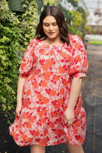 Short sleeve plus size pink floral dress with a square neck.