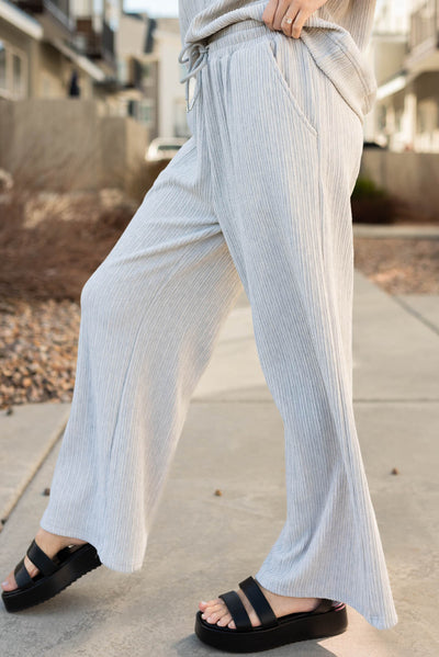 Side view of the sage grey textured pants with pockets