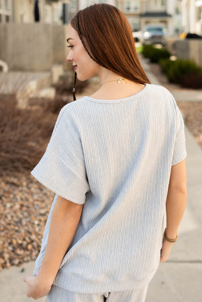 Back view of the sage grey textured top