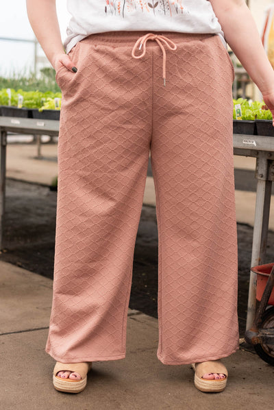Plus size dusty pink textured pants with elastic waist and pocket