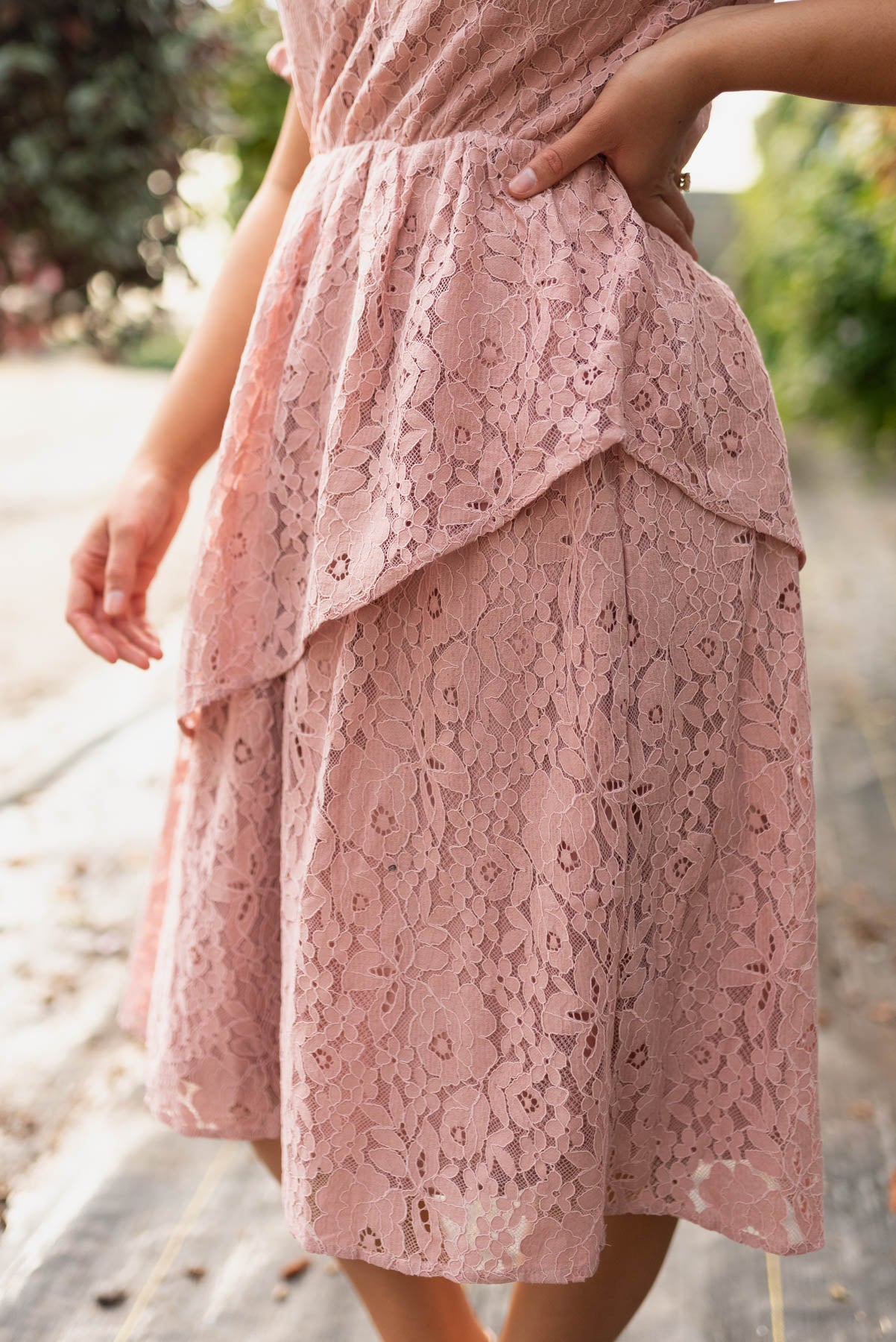 Close up of the lace skirt on the dusty pink lace tiered dress