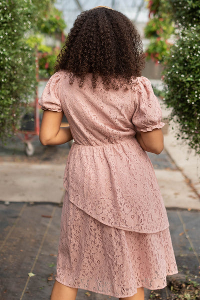 Back view of the dusty pink lace tiered dress