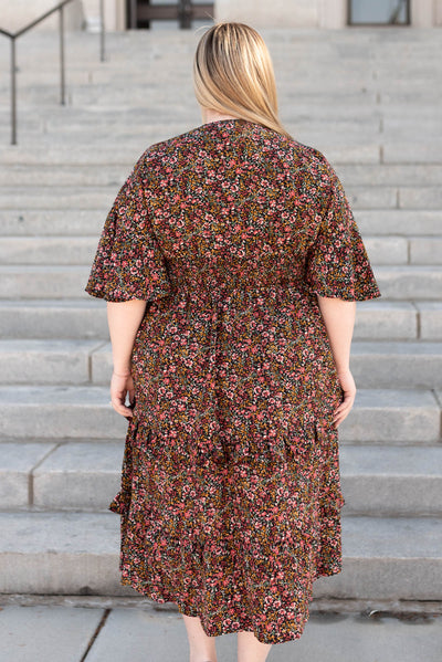 Back view of a plus size floral tiered ruffle dress