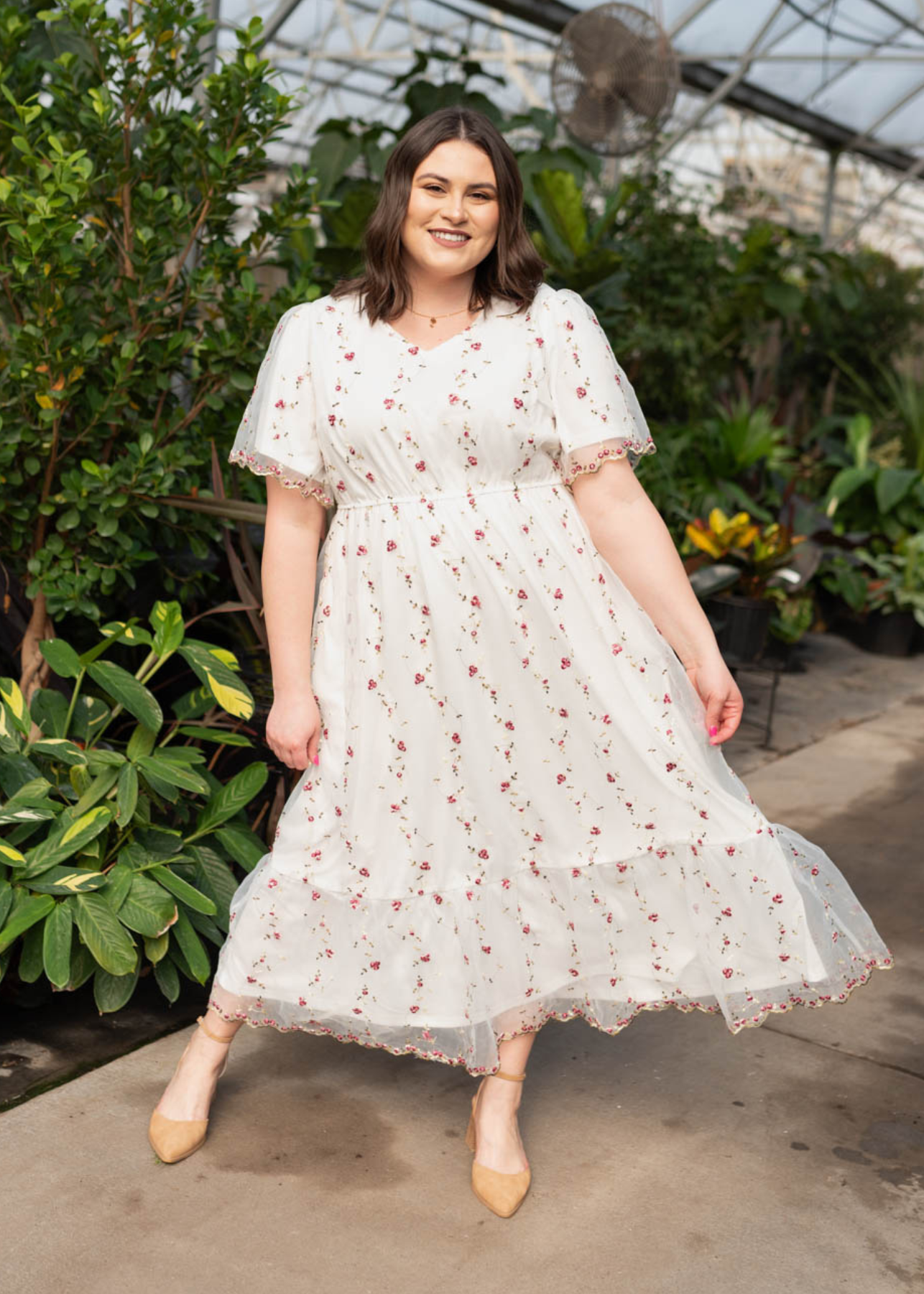 Plus size ivory embroidered floral dress with short sleeves and ruffle at the hem