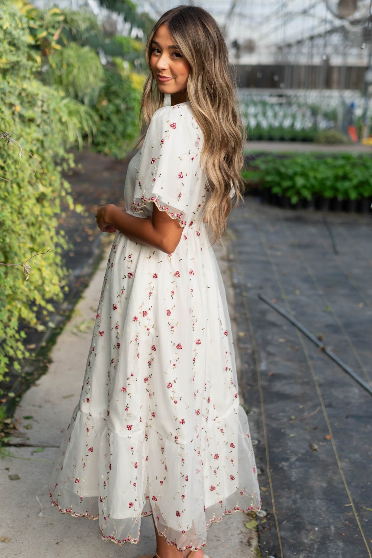 Side view of the ivory embroidered floral dress