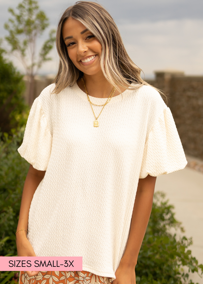 Cream textured top with full sleeves