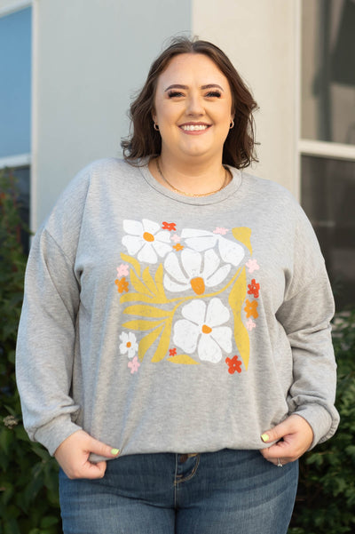Plus size heather grey pullover with a floral print