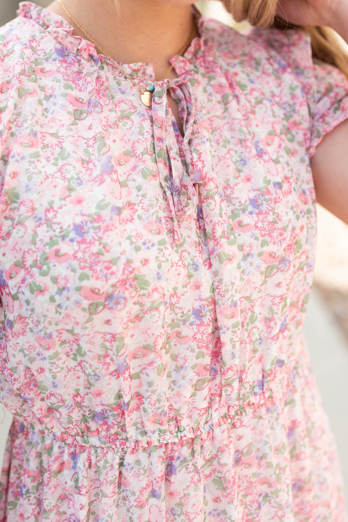 Close up of the bodice on the pink floral tiered dress