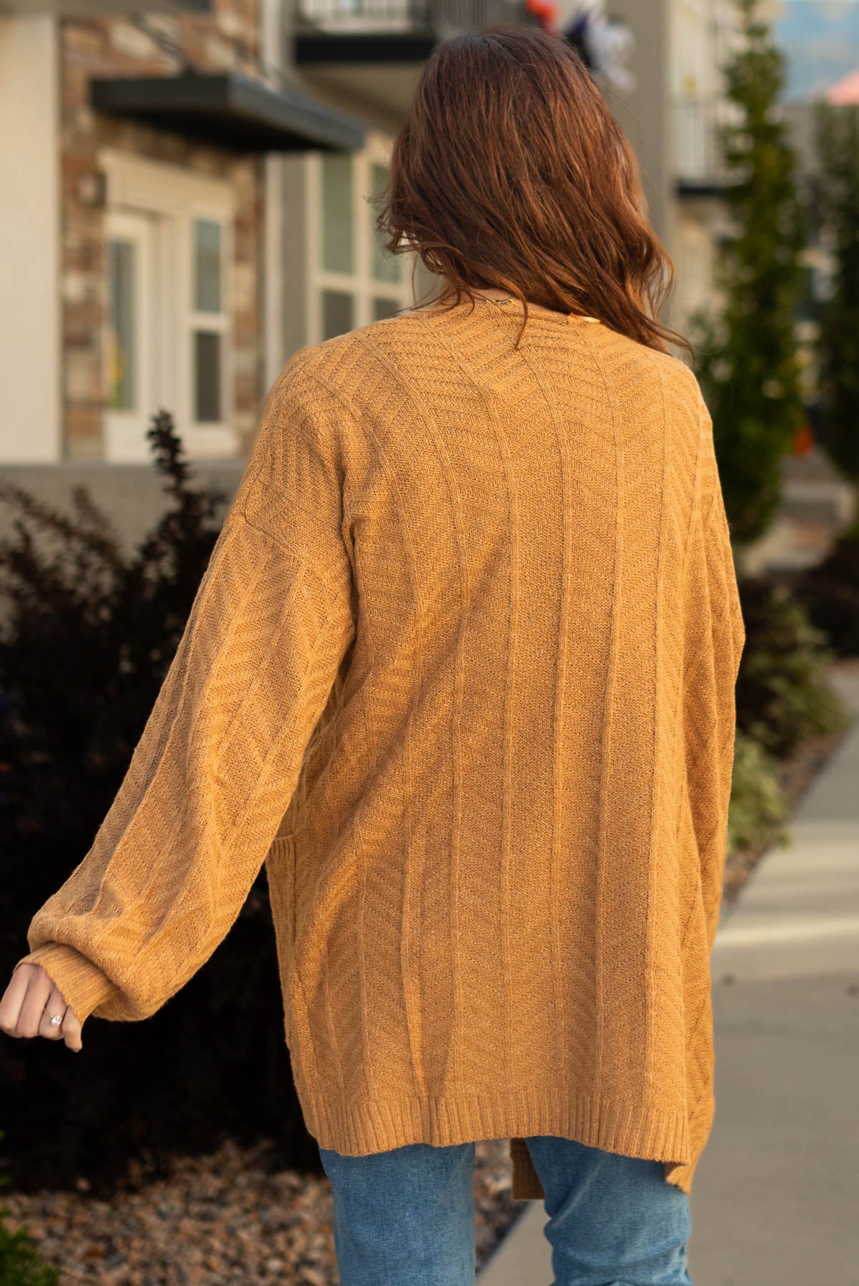 Back view of a mustard cardigan