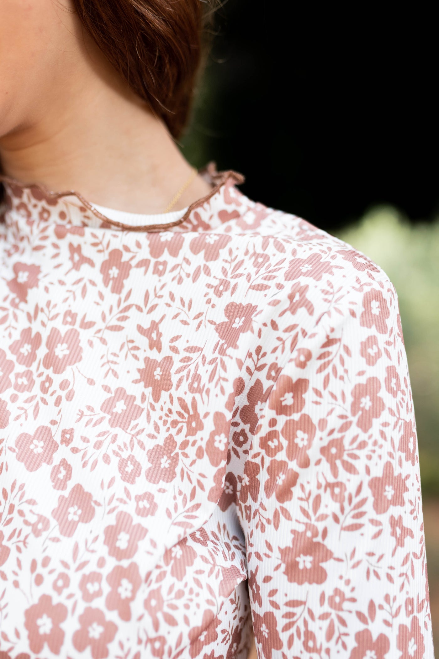 Close up of a brown floral top
