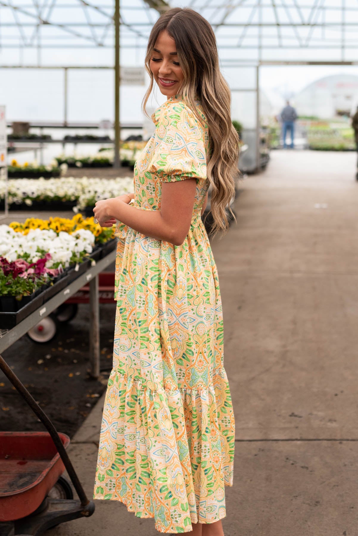 Side view of the green floral dress with short sleeves
