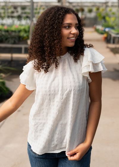 White ruffle sleeve top with short sleeves