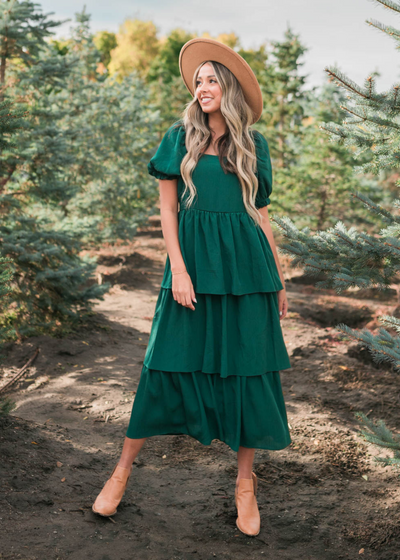 Green ruffle tiered dress with short sleeves and a square neck