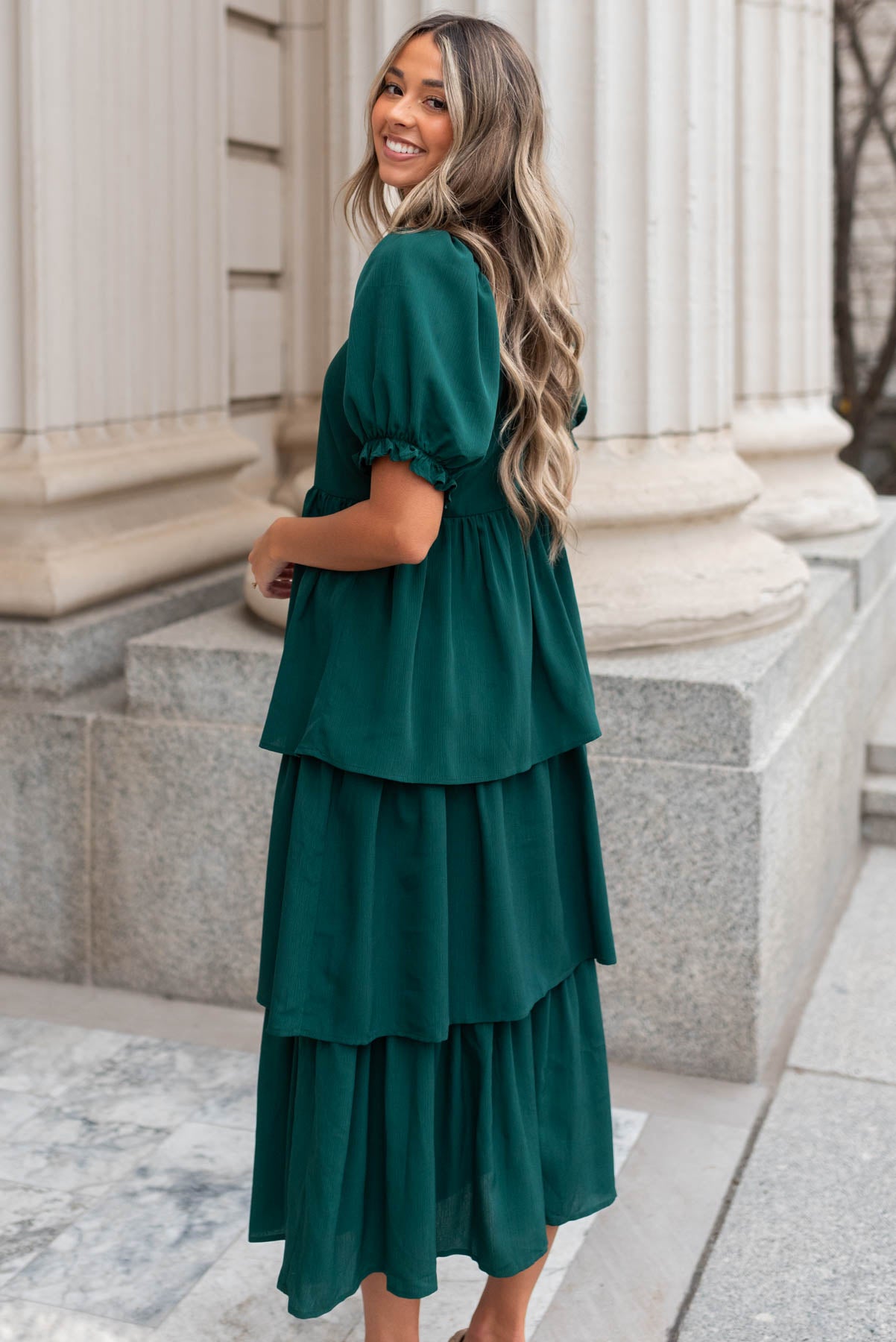 Side view of a green ruffle tiered dress