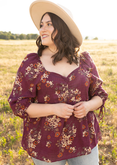 Plus size plum floral top with sweetheart neck and 3/4 sleeves