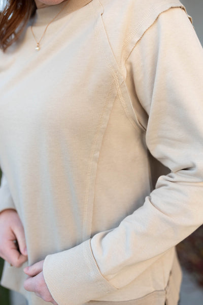 Taupe sweater with outside seams