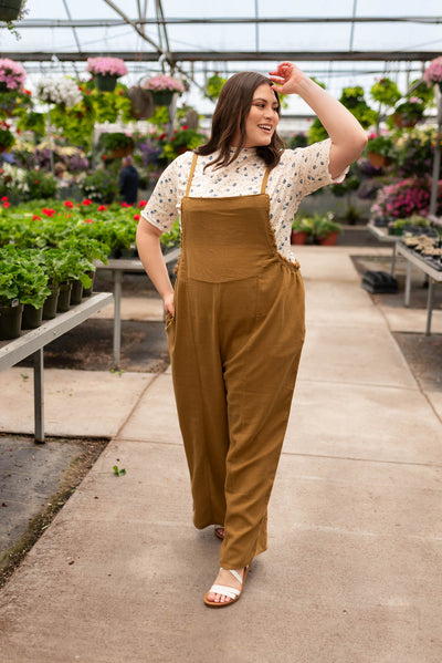 Plus size dark mustard washed jumpsuit with pockets and tapered leg