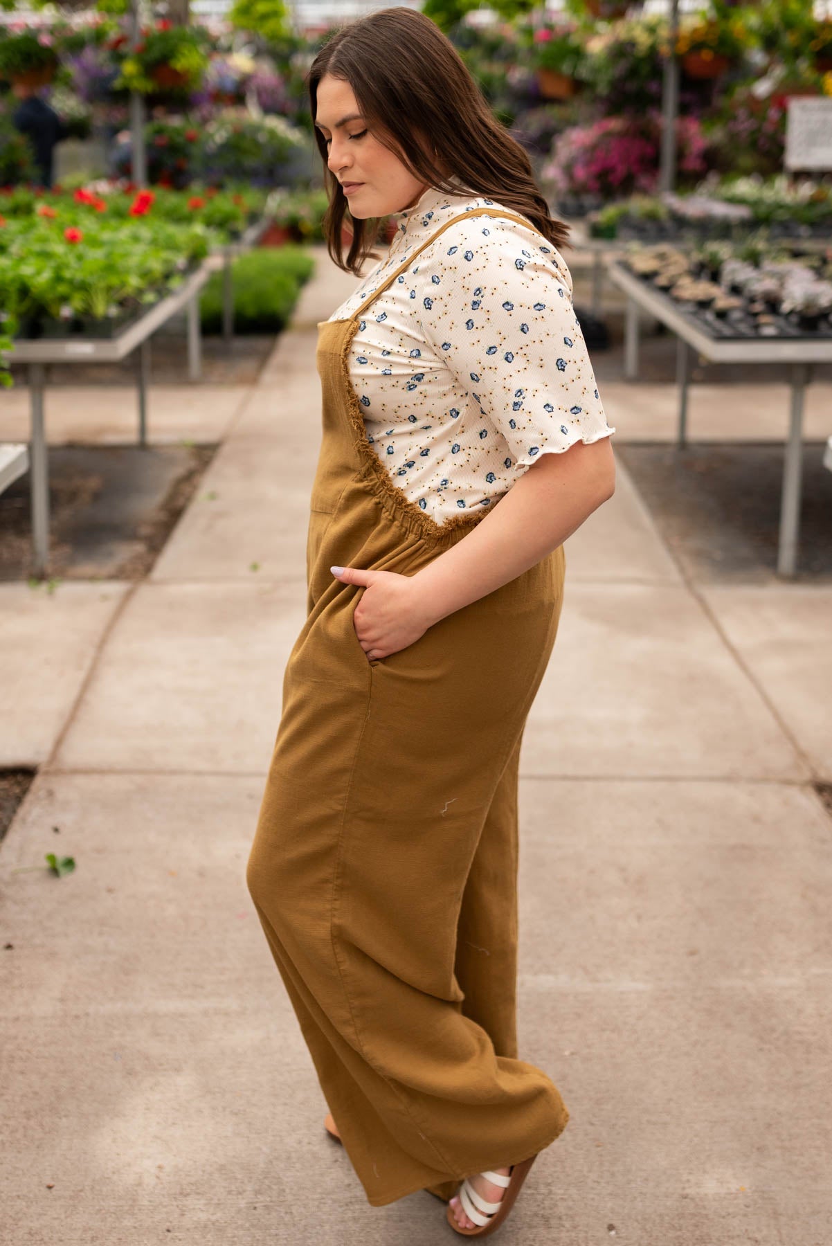 Side view of the plus size dark mustard washed jumpsuit
