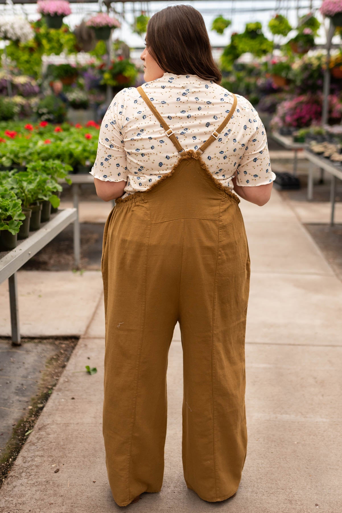 Back view of the plus size dark mustard washed jumpsuit