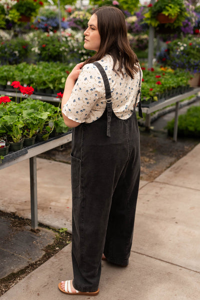 Side view of the plus size charcoal washed jumpsuit