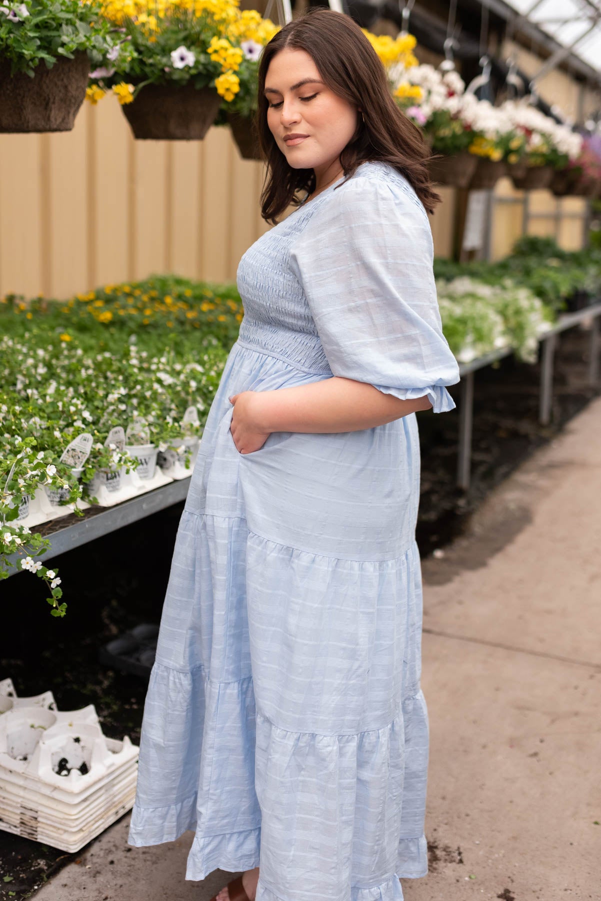 Side view of the plus size sky blue maxi dress with pockets