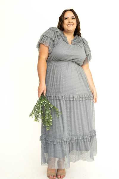 Plus size of a blue gray lace short sleeve dress with ruffles on sleeves and neck.
