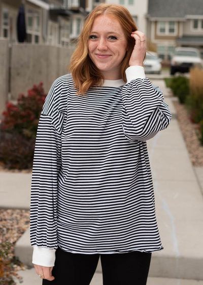 Long sleeve black top with stripes and white trim