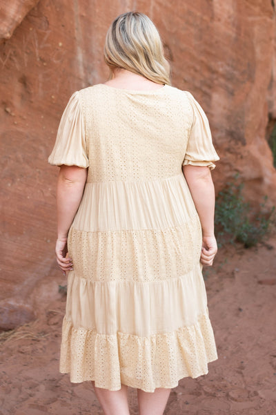 Back view of a beige dress