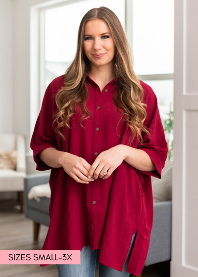 Burgundy button down blouse with a collar and short sleeves
