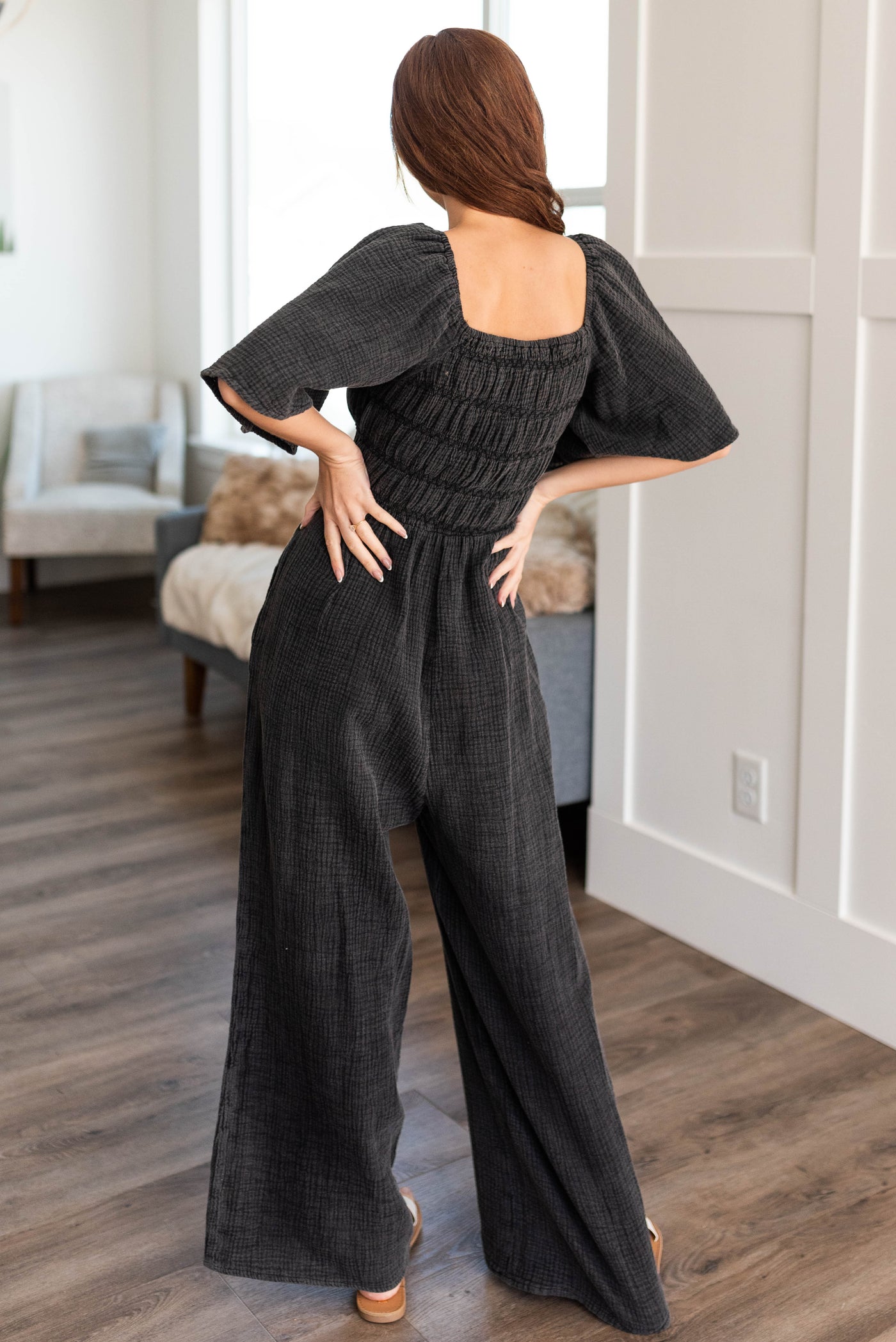 Back view of the charcoal wide leg jumpsuit