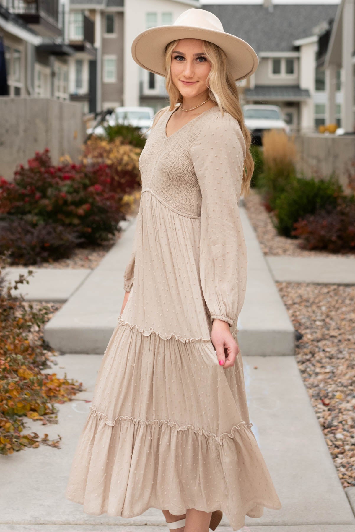 Side view of the stone textured dress with tiered skirt