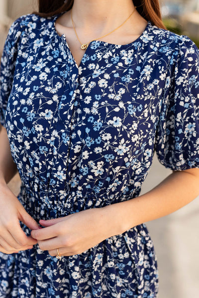 Close up of the fabric on the navy floral dress