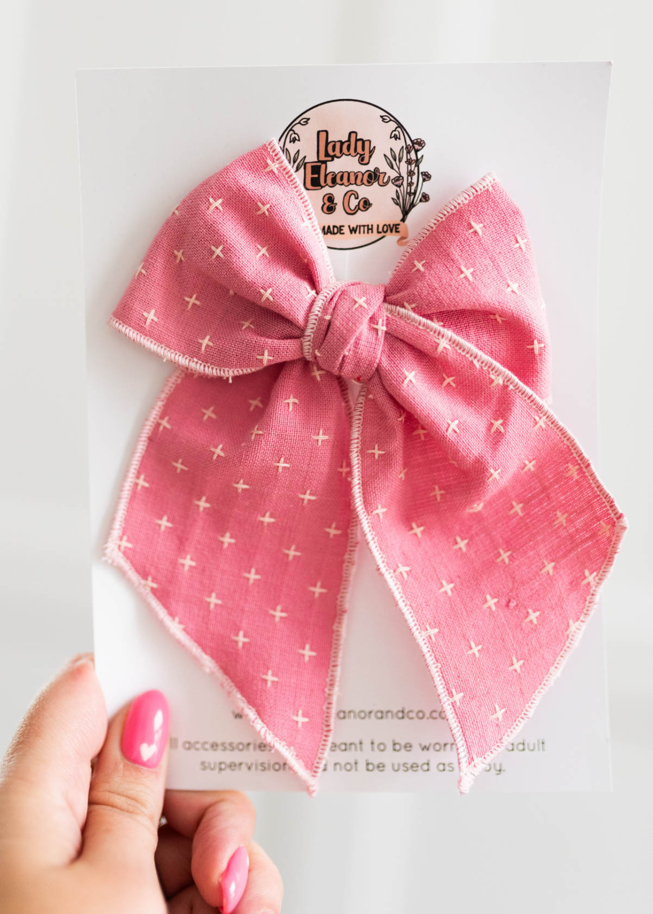 Pink stitched bow