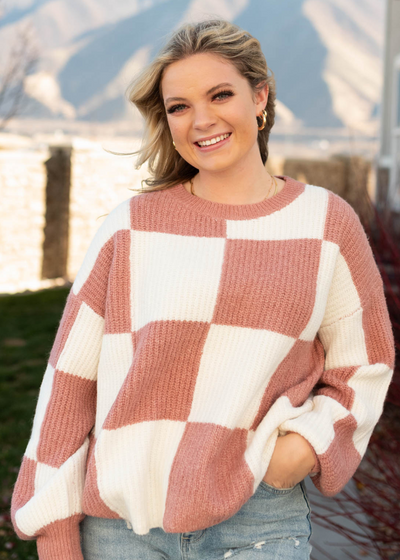 Checkered pattern on a marsala sweater