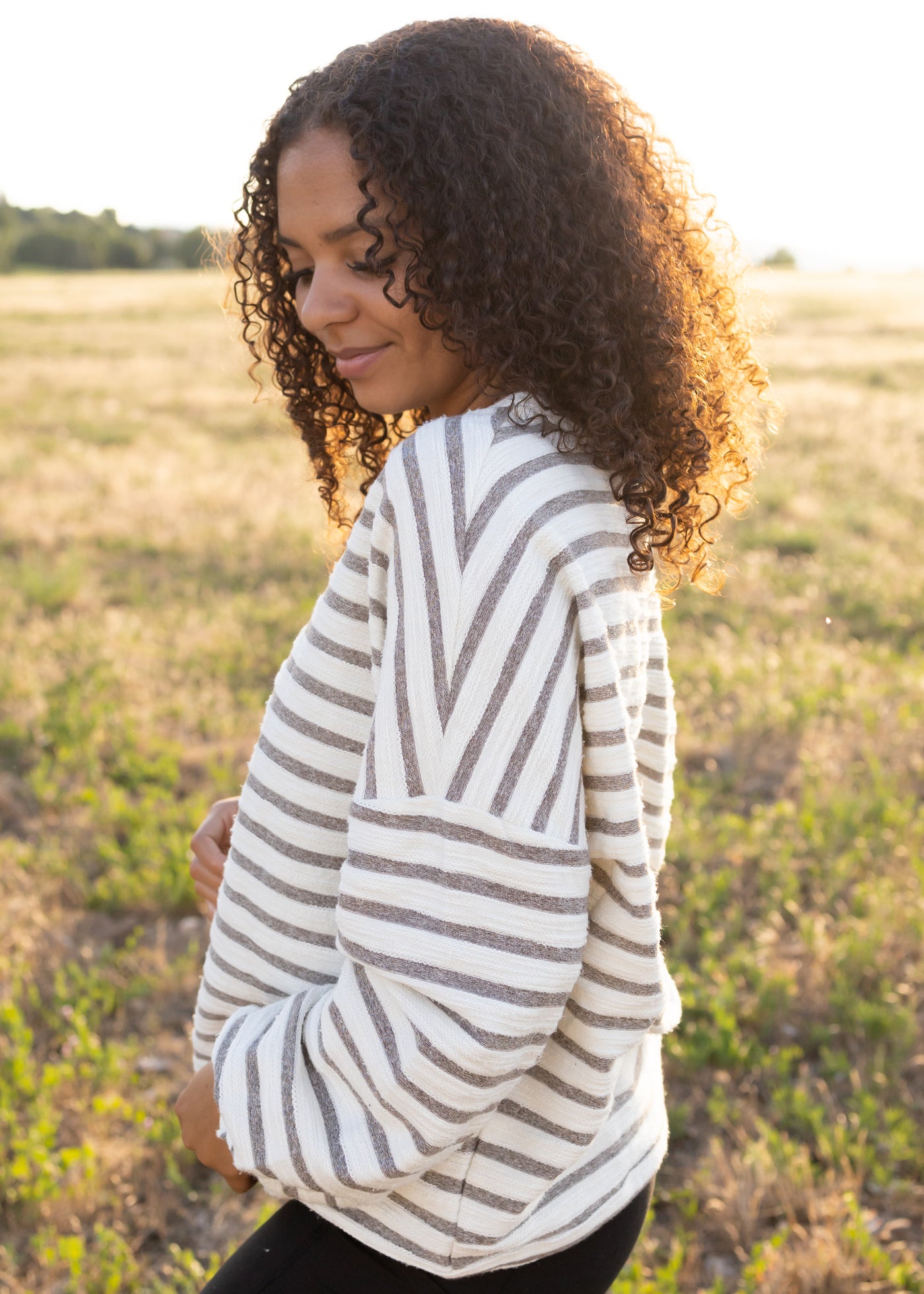 Side view of a striped heather gray top