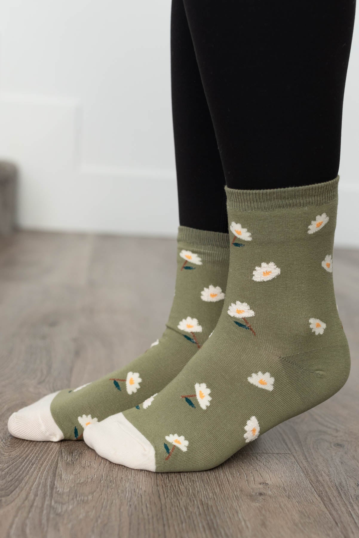 Side view of the olive daisy garden socks