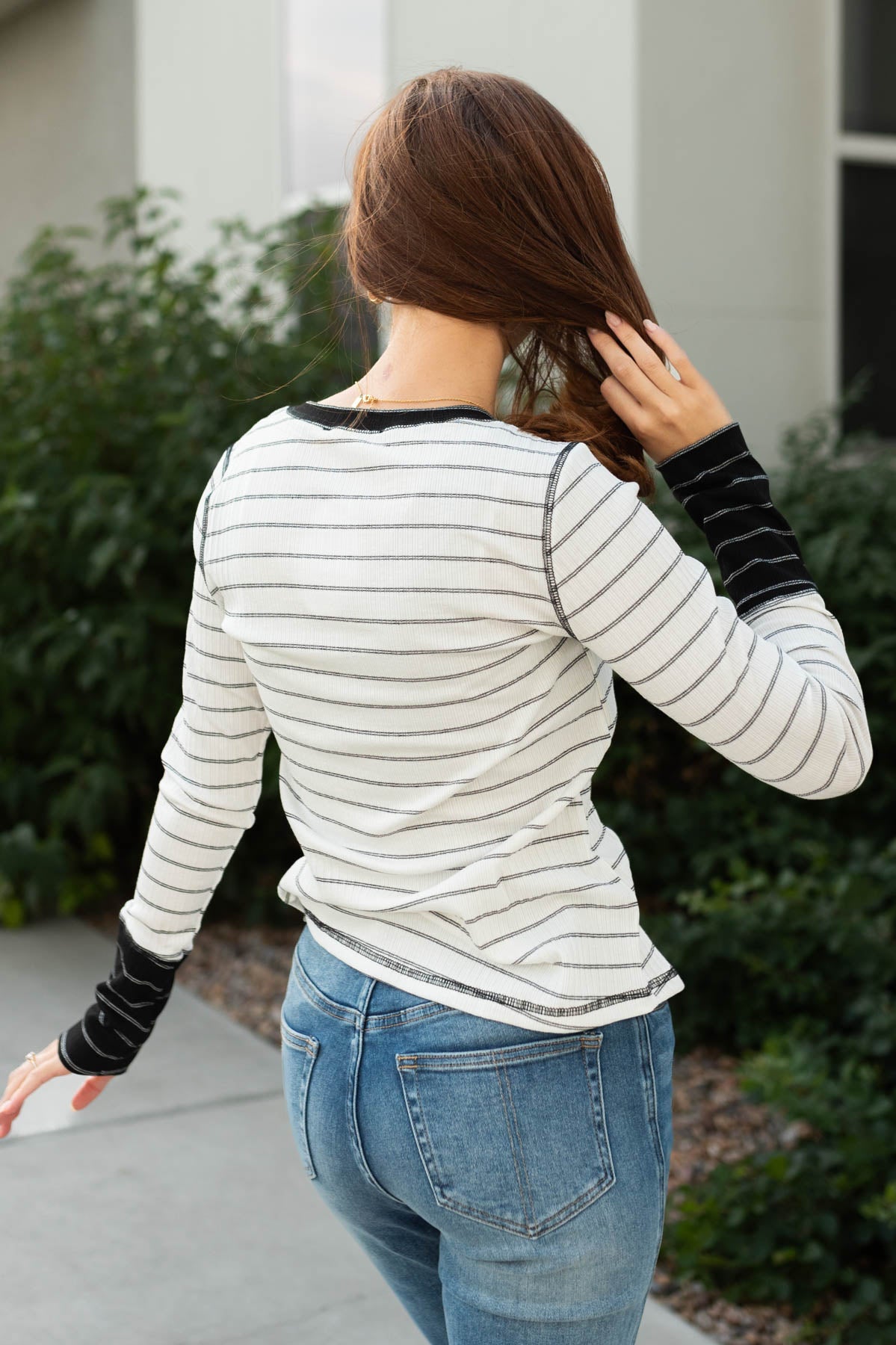 Back view of a blacked striped top