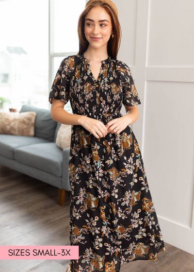 Black floral dress with smocked bodice and short sleeves