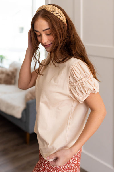 Side view of the cream puff sleeve top
