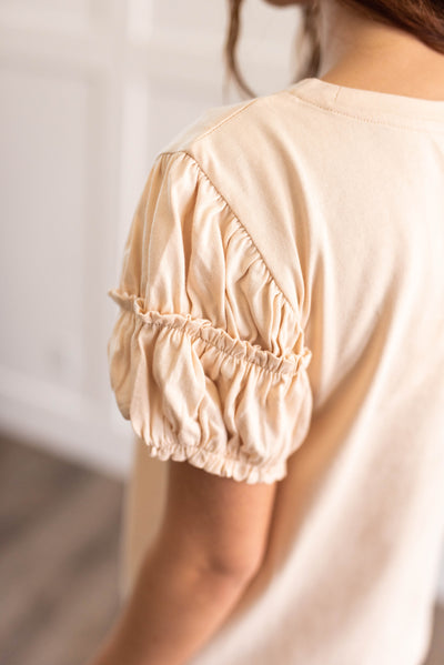 Sleeve detail on a cream puff sleeve top