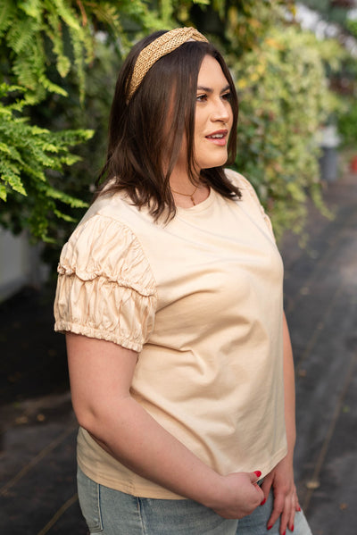 Side view of the plus size cream puff sleeve top
