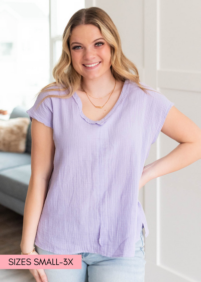 Lavender top with short sleeves and a v-neck