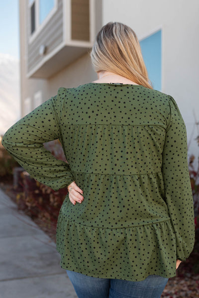 Back view of a plus size olive tiered top