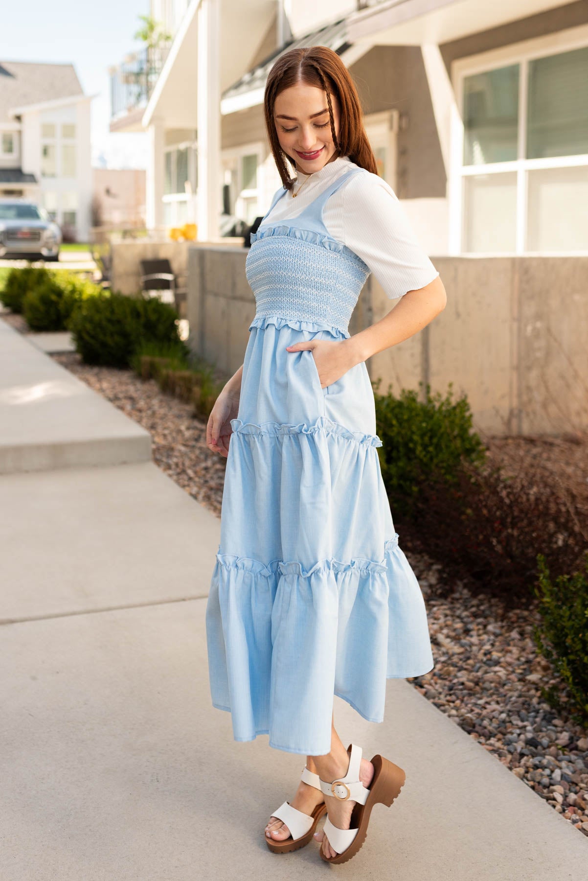 Side view of the blue square neck dress with pockets