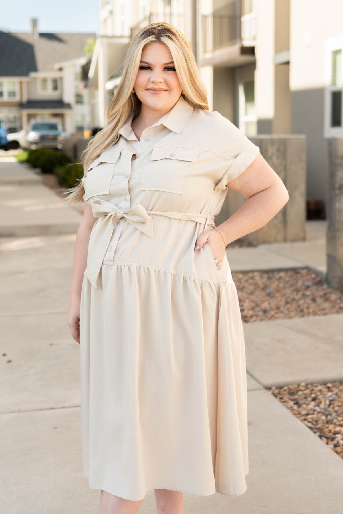 Side view of the beige button down dress
