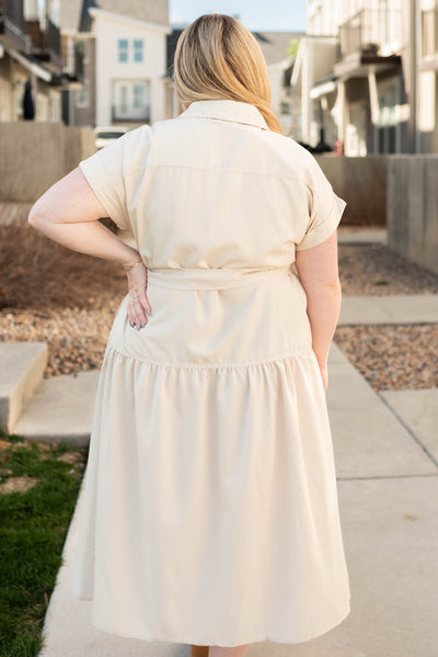 Back view of the plus size beige button down dress