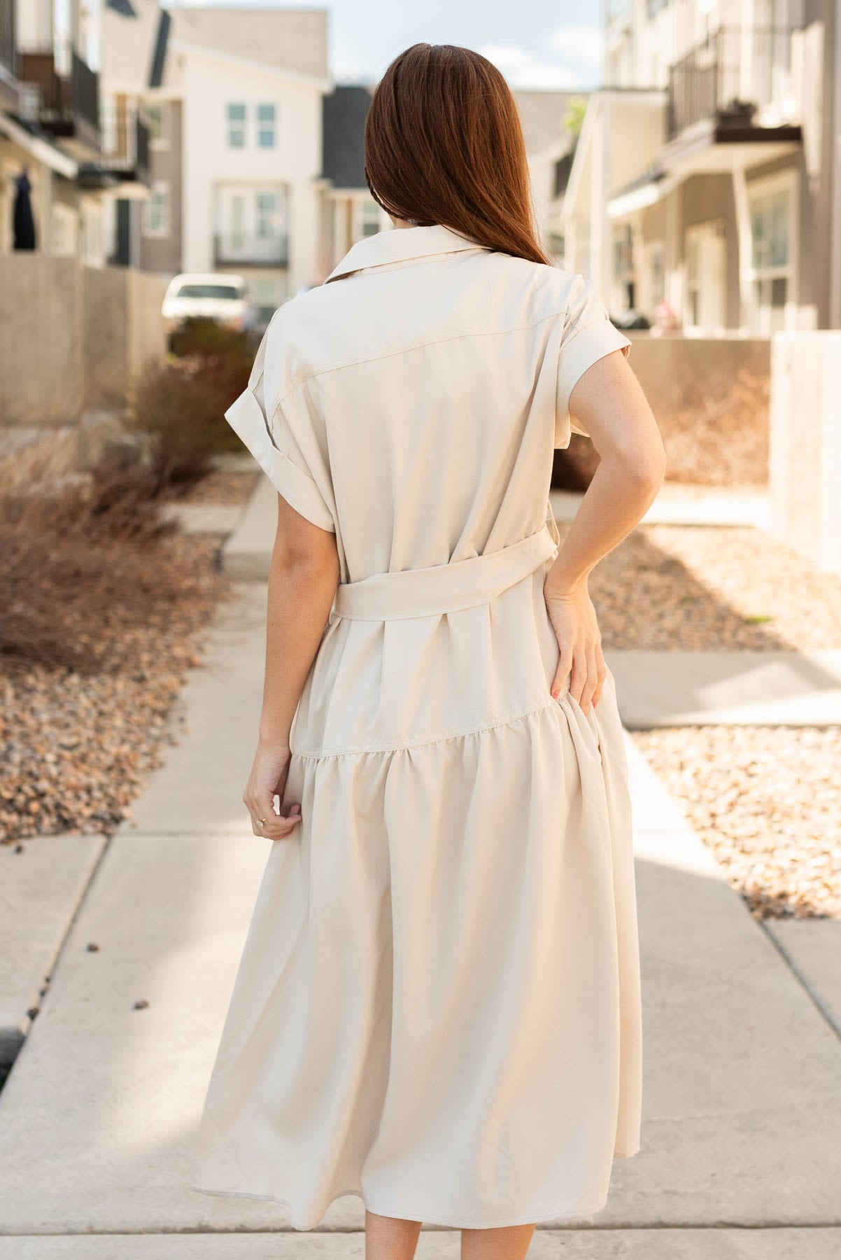 Back view of the beige button down dress 