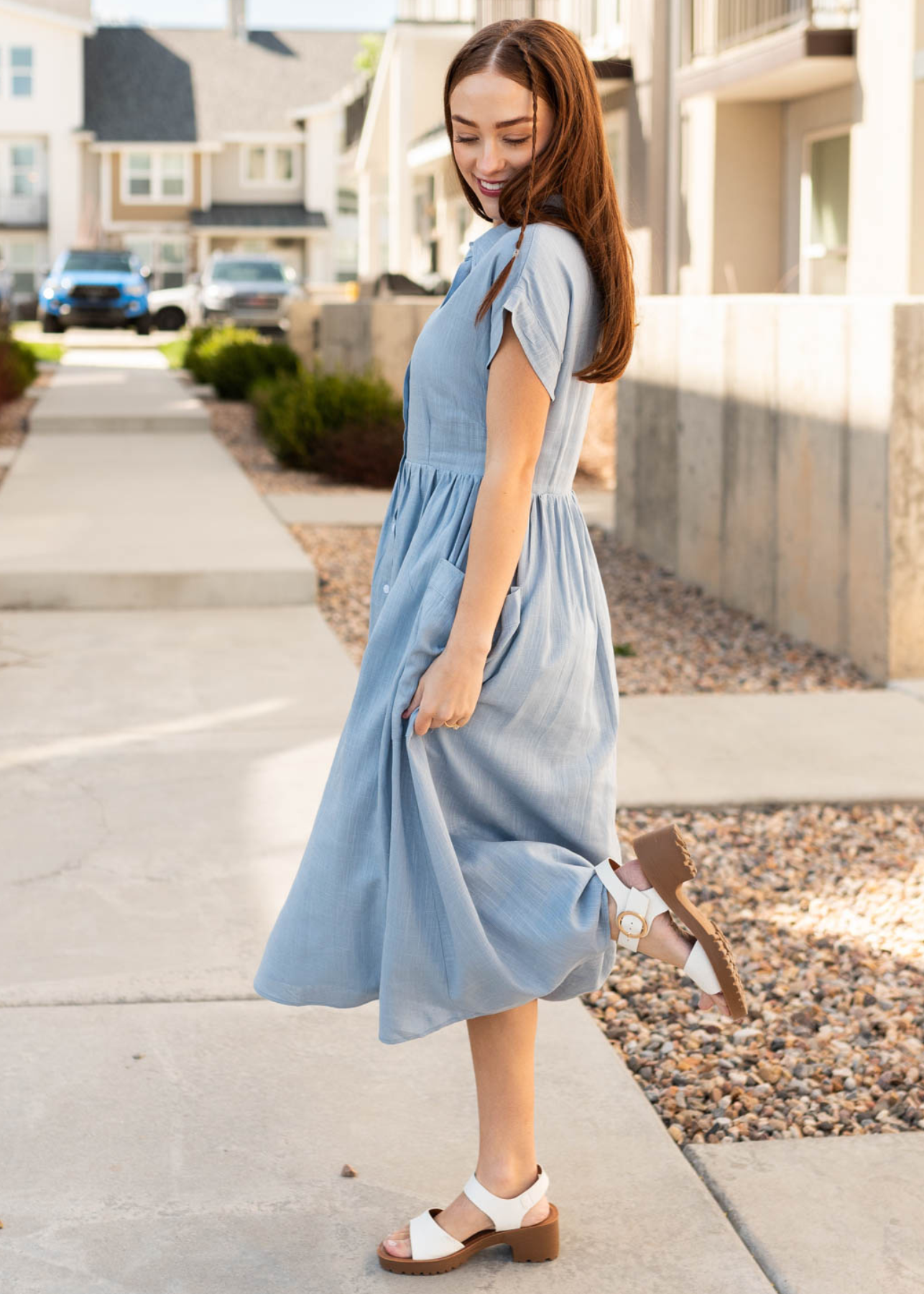 Side view of the blue button down dress